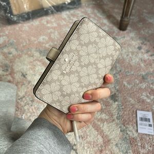 Kate Spade mushroom cap spade flower bifold wallet. Dark beige. New with tags.